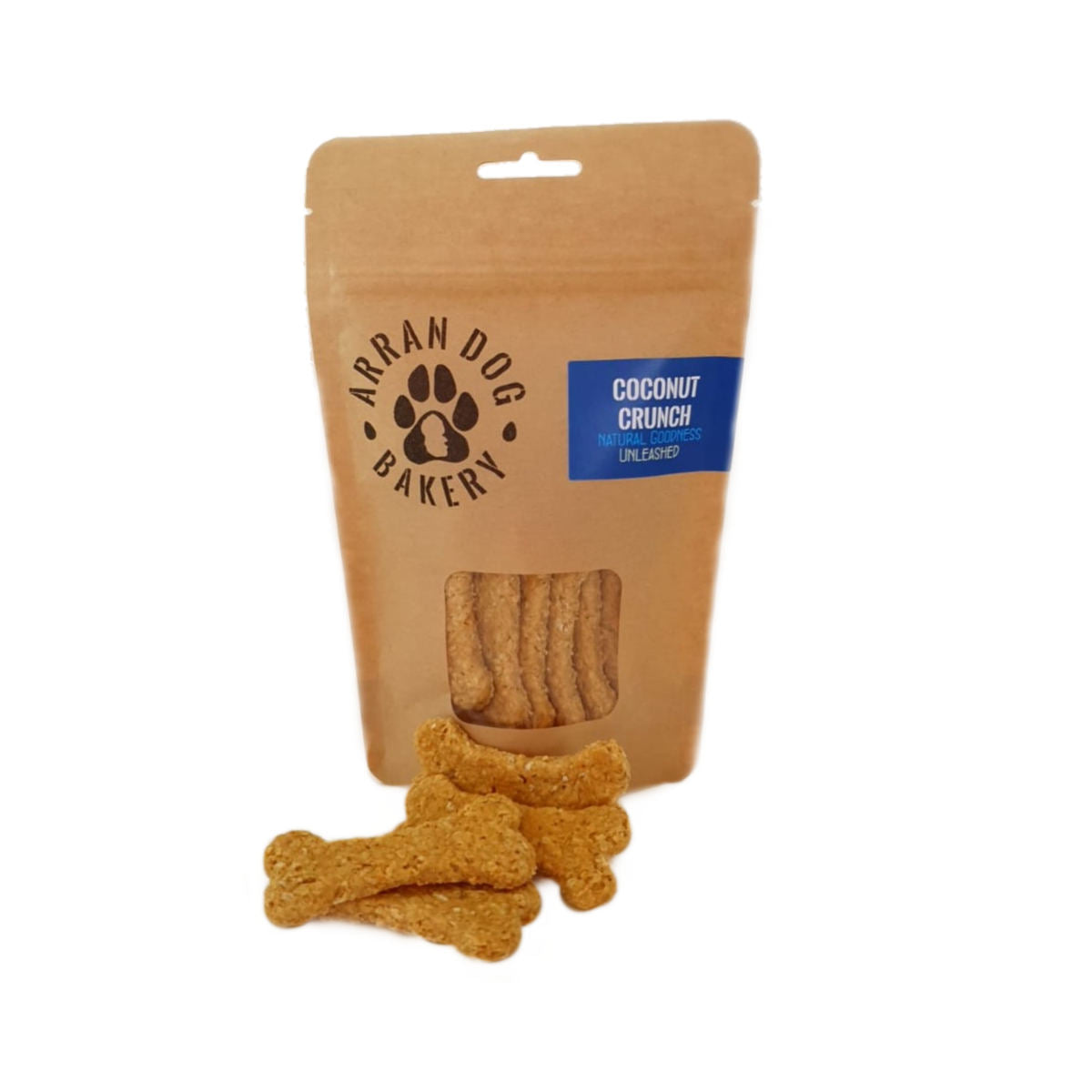 The brown paper package, featuring a transparent window, showcases bone-shaped treats labeled "Arran Dog Bakery" and "Coconut Crunch Arran Dog Biscuits." These homemade, vegetarian-friendly dog treats boast all-natural ingredients. Four delicious-looking treats are enticingly arranged in front of the package.