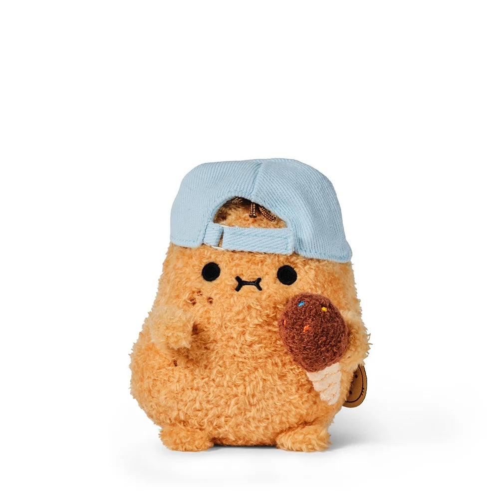 The Noodoll Ricespud Hot Potato is a plush toy shaped like a fuzzy orange potato, wearing a light blue cap and holding a brown chocolate ice cream cone with colorful sprinkles.