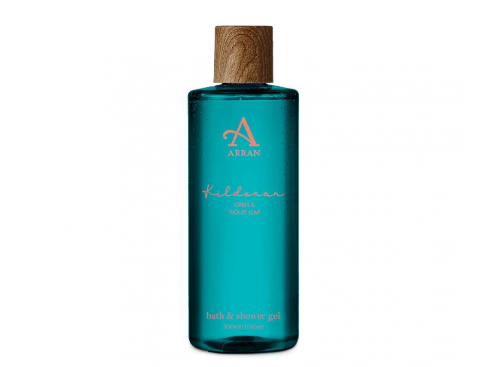 This 300ml bottle of Kildonan Bath and Shower Gel by Arran Sense of Scotland showcases a vibrant turquoise hue with a wooden cap, and its label proudly highlights "Orris & Violet Leaf," offering a fragrant journey to the serene Scottish shores.