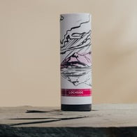 A cylindrical container stands on a flat surface, featuring abstract black and pink artwork. The label reads "Lochside." The background is a soft beige.