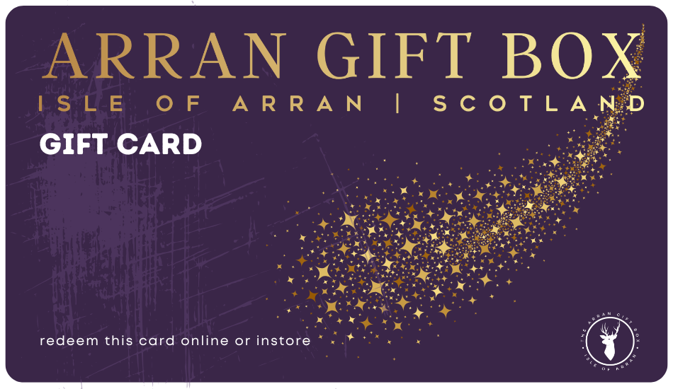 A purple Arran Gift Box gift card from the Isle of Arran, Scotland, featuring gold text, a trail of gold stars, and a white stag logo, with instructions to redeem online or in store.