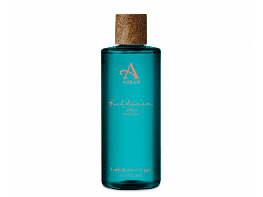 Blue bottle of ARRAN bath and shower gel with a wooden cap. The label reads "ARRAN, Kildonan, Orris & Violet Leaf, bath & shower gel, 300ml.