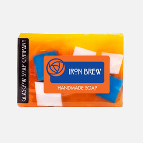 A rectangular Iron Brew Handmade Soap Slice with orange, blue, and white blocks is shown against a plain white background.