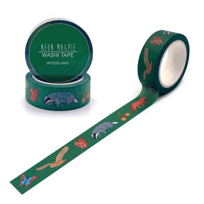 Woodland Washi Tape: a biodegradable roll with green woodland animal designs—badger, fox, owl, butterfly, and leaves—beside its packaging. Great for creative gift wrapping.
