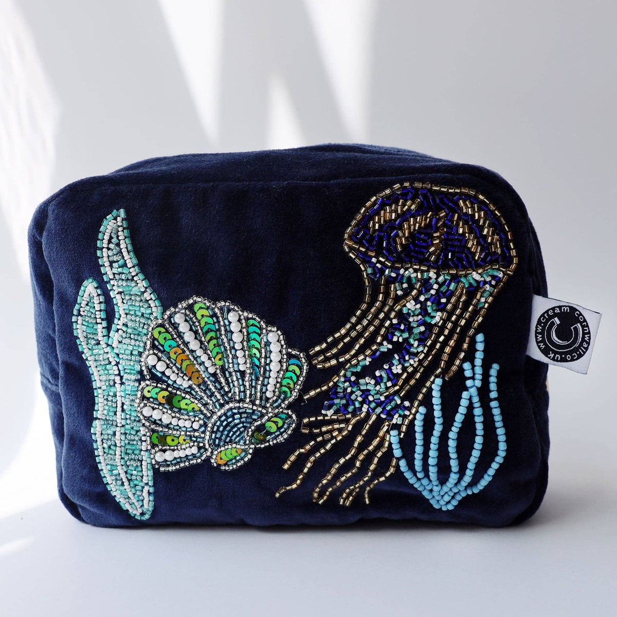 Navy velvet cosmetic bag with beaded jellyfish by Cream Cornwall