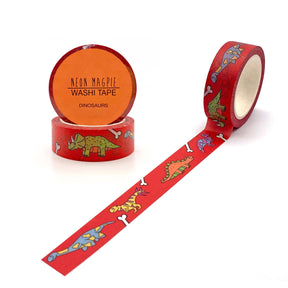 A roll of Dinosaur Washi Tape featuring colorful dinosaur and bone designs, perfect for bullet journal decoration. The label shows "Neon Magpie Washi Tape Dinosaurs" and the eco-friendly tape is partially unrolled.