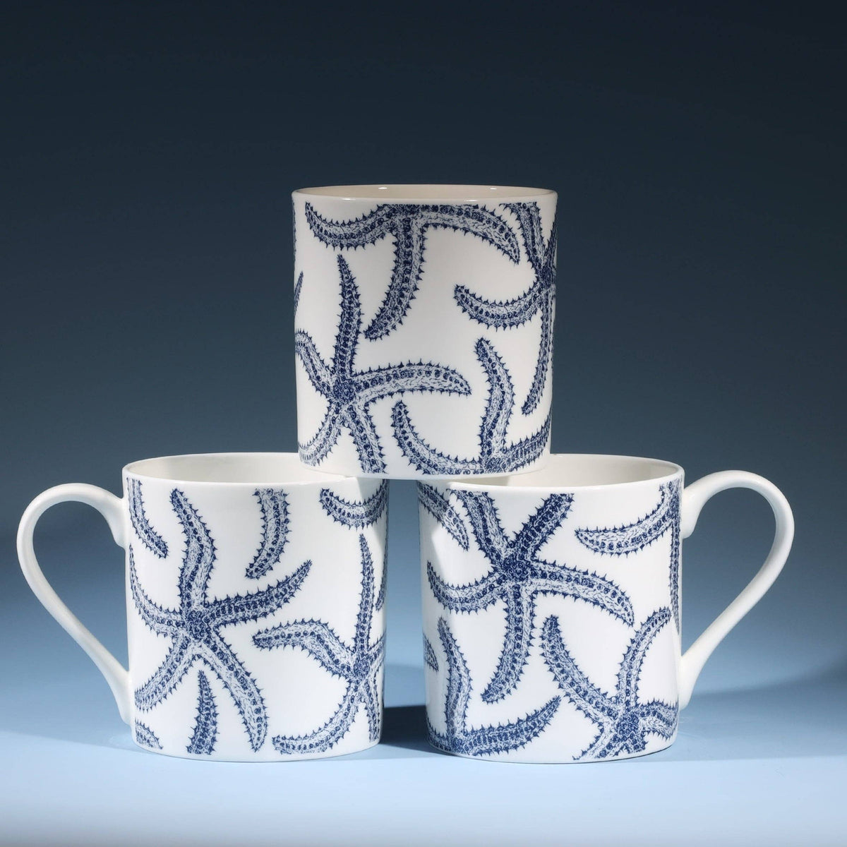 Navy starfish bone china mug, 375ml by Cream Cornwall