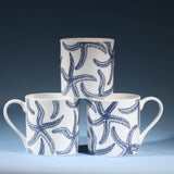 Navy starfish bone china mug, 375ml by Cream Cornwall