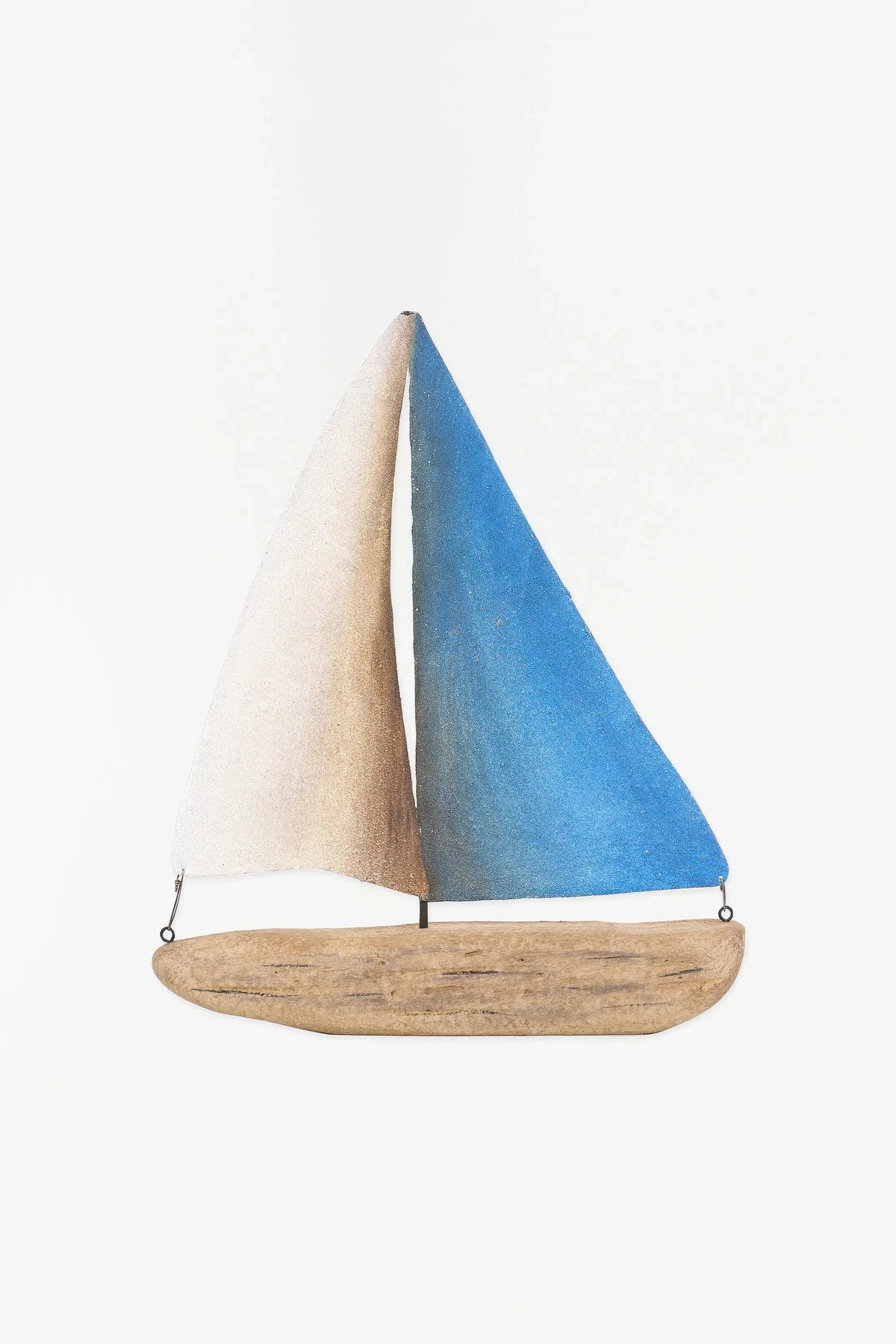 Batela decorative wooden sailboat with white and turquoise metal sails.