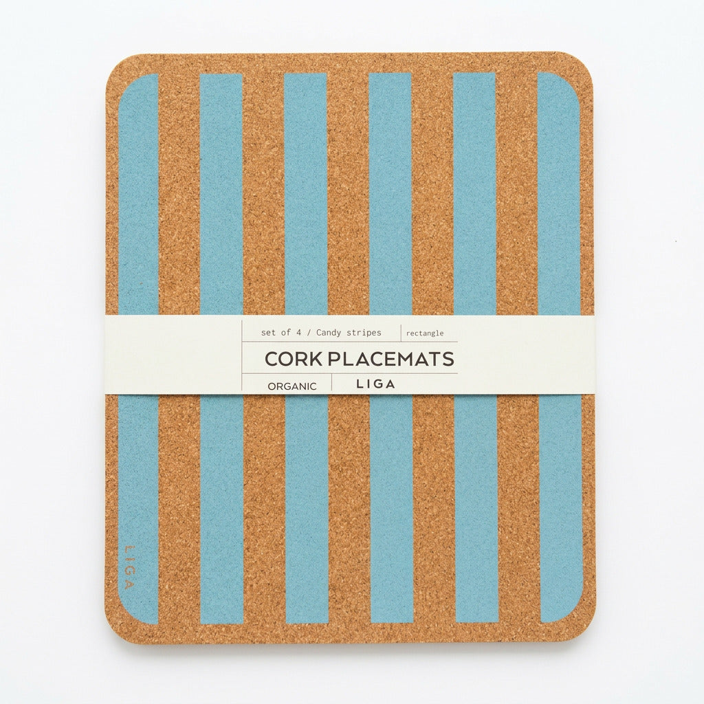 A stack of four rectangular Blue Candy Stripe Cork Placemats with blue vertical stripes, held together by a paper band labeled “CORK PLACEMATS.”