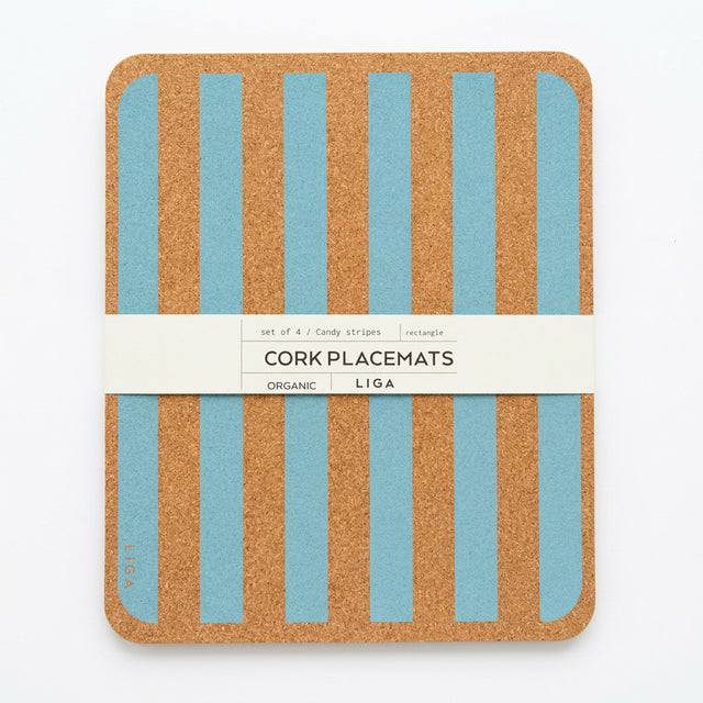 A stack of four rectangular Blue Candy Stripe Cork Placemats with blue vertical stripes, held together by a paper band labeled “CORK PLACEMATS.”