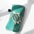 Turquoise velvet glasses case with beaded turtle by Cream Cornwall