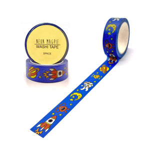 Two rolls of Space Washi Tape with rockets, planets, stars, and astronauts add a cosmic touch to projects. One roll stands upright with a "Neon Magpie Washi Tape Space" label. Biodegradable—perfect for gift wrapping and crafts.