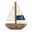 A Batela Wooden Sailboat featuring a distressed white sail with a blue horizontal stripe and the letters “CE,” perfect for coastal home accessories.