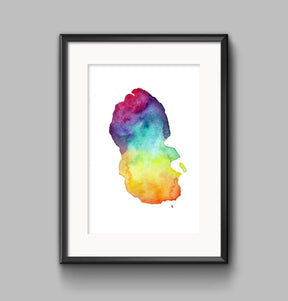 Arran Map Print A4—a framed abstract watercolor art piece inspired by Scottish landscapes, featuring vibrant red, purple, blue, green, and yellow on white, showcased against a light gray wall.