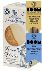 A box of Island Bakery Lemon Melts—lemon biscuits half-dipped in white chocolate—featuring two awards: "The Nation's Favourite Organic Product 2017" and "Best Scottish Organic Product 2019.