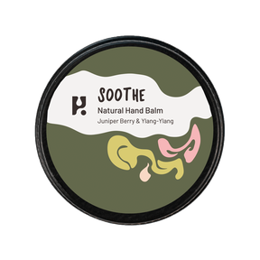Soothe Natural Hand Balm comes in a round tin with a green, white, and pastel abstract label—ideal for nourishing hand care with juniper berry and ylang-ylang.