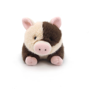 The Spotty Pig Soft Plush Toy - 20cm features a cream and brown face, pink snout, ears, and feet. This adorable vegan plush toy sits upright on a white background—perfect as a sustainable gift.