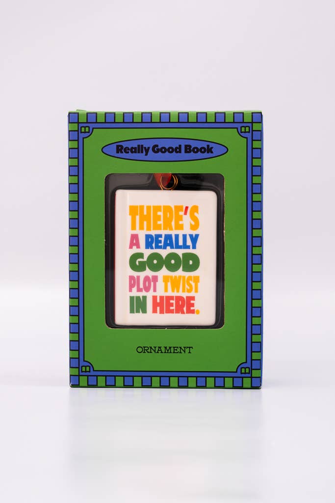 A ban.do Ornament, Book in a green and blue box, featuring the text “There’s a really good plot twist in here.”
