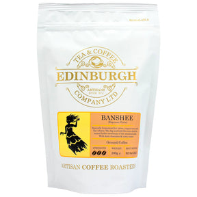 A 200g white bag of Banshee Beans espresso forte blend from Edinburgh Tea & Coffee Company, featuring a yellow label with a banshee silhouette and product details.