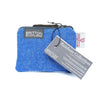 The Rainbow Harris Tweed Purse features authentic blue Harris Tweed, product tags, and a “Rainbow Collection” label—a stylish accessory that highlights true Scottish craftsmanship.