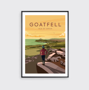 Framed Catriona Tod Goatfell Print: A hiker stands on rocky ground overlooking green hills, water, and a golden sky. Features the text "GOATFELL Isle of Arran.