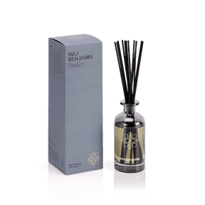The Max Benjamin – Dodici Reed Diffuser brings Italian chic to your home with a grey box, glass bottle, black reed sticks, and natural oils—all set against a white background.