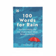 The blue book "100 Words for Rain" features a red umbrella, raindrops, and offers funny rain words plus surprising British weather facts—all displayed on a shelf.