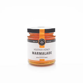 Heather Honey Marmalade in a jar with a black lid and white label featuring black and gold text, displayed on a plain white background, highlights the natural sweetness of Scottish honey.
