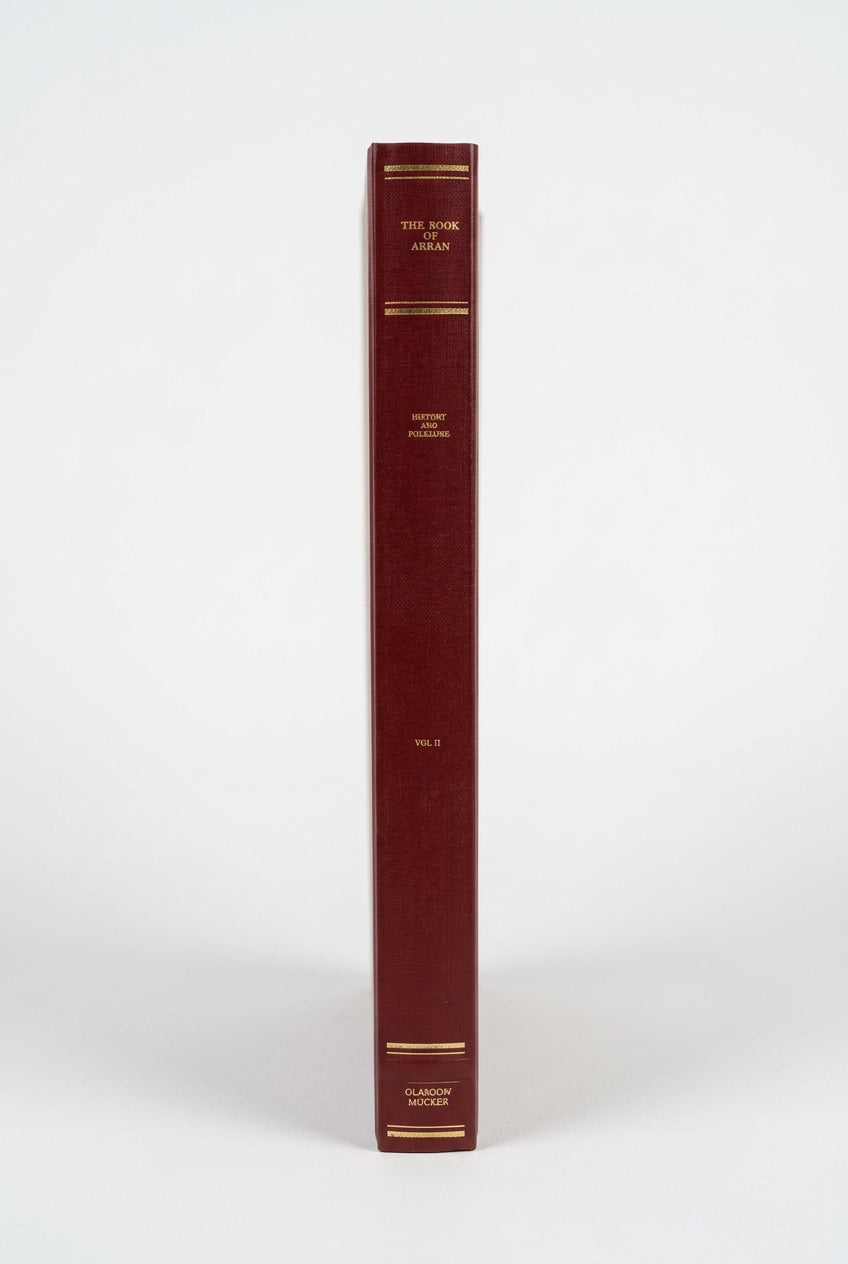 The spine of a burgundy book from The Book of Arran – Volumes 1 & 2 | Glasgow Society of Arran Reprints, featuring gold lettering that reads “The Book of Arran,” “History and Folklore,” “Vol. II,” and “Olasoon Mucker.”