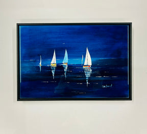 The Sailing into The Blue Ceramic Tile features four sailboats with white sails gliding on a deep blue sea, their reflections shimmering in the water beneath a dark blue sky.