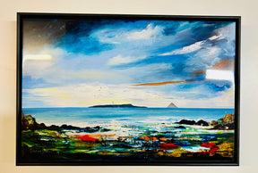 Ceramic tile featuring a vibrant coastal scene inspired by Arran, depicting Ailsa Craig and Pladda with a colorful foreground, rocky shore, calm blue sea, and a dramatic sky.