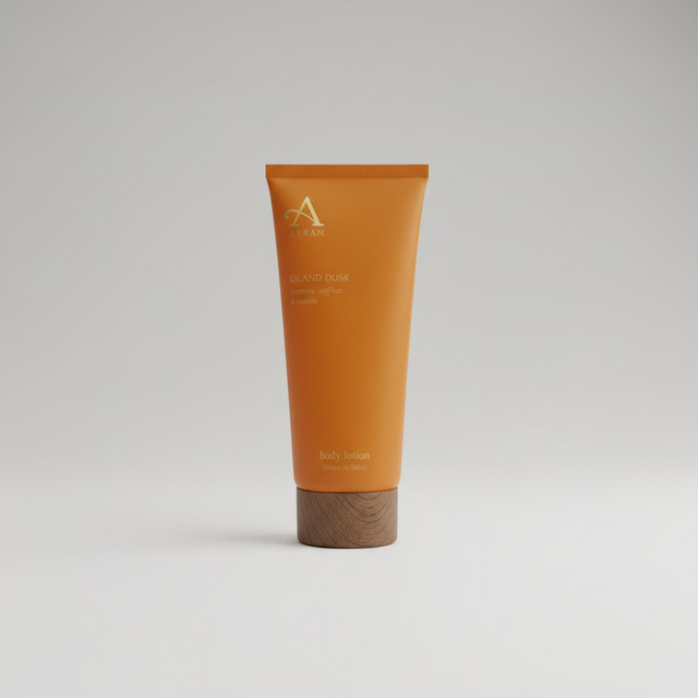 A 200ml tube of ARRAN Sense of Scotland Island Dusk Body Lotion with a wooden cap stands upright against a plain white background, capturing the serene spirit of the Isle of Arran.