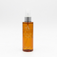 A brown spray bottle of Island Dusk Body Mist 100ml from ARRAN Sense of Scotland, inspired by the Isle of Arran and offering a captivating blend of ginger, saffron, and vanilla scents, is shown against a plain white background.