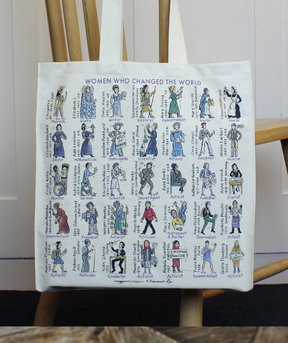 The Women Who Changed The World Tote Bag by McLaggan and Co is made from unbleached cotton and features vibrant illustrations along with the names of 36 remarkable women, each accompanied by an icon or symbol representing their achievements. This inspiring tote hangs on the back of a wooden chair.