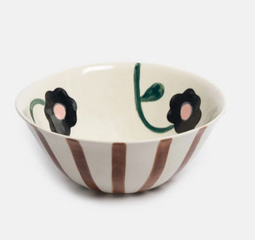 Caroline Gardner Rust Stripe and Flowers Medium Bowl, a dishwasher-safe stoneware piece featuring rust-colored vertical stripes on the exterior and hand-painted dark flowers with pink centers on the interior.