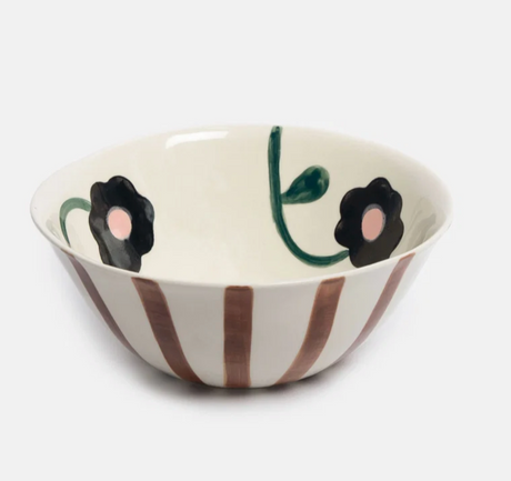 Caroline Gardner Rust Stripe and Flowers Medium Bowl, a dishwasher-safe stoneware piece featuring rust-colored vertical stripes on the exterior and hand-painted dark flowers with pink centers on the interior.