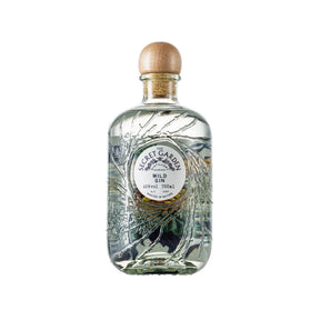 A clear glass bottle of Secret Garden Wild Gin Made with Organic Spirit 70cl features an embossed botanical design, wooden cap, and minimalist label that reflects its Scottish heritage and wild botanicals.
