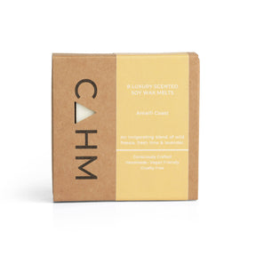 The "Amalfi Coast" luxury soy wax melts from CAHM, in a brown and yellow gift box, combine wild freesia, fresh lime, and lavender for an invigorating aroma. Handmade, vegan-friendly, cruelty-free, and hand-poured for a luxurious experience.
