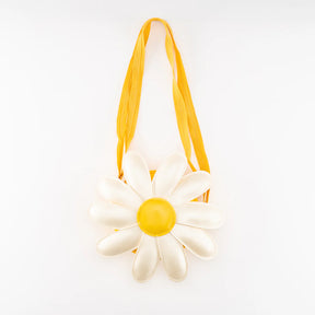 The Children's Daisy Bag features a daisy flower shape with white petals, a yellow center, and an adjustable strap. Ideal for spring and summer outfits, it's shown on a plain white background.