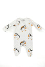 White baby onesie with long sleeves, made from 100% cotton and featuring a repeating pattern of adorable illustrated Highland cows in brown and white. The cute Highland Cow Baby Sleepsuit is displayed flat on a white background.