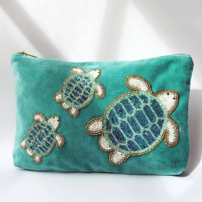 Turquoise velvet pouch bag with beaded turtles by Cream Cornwall