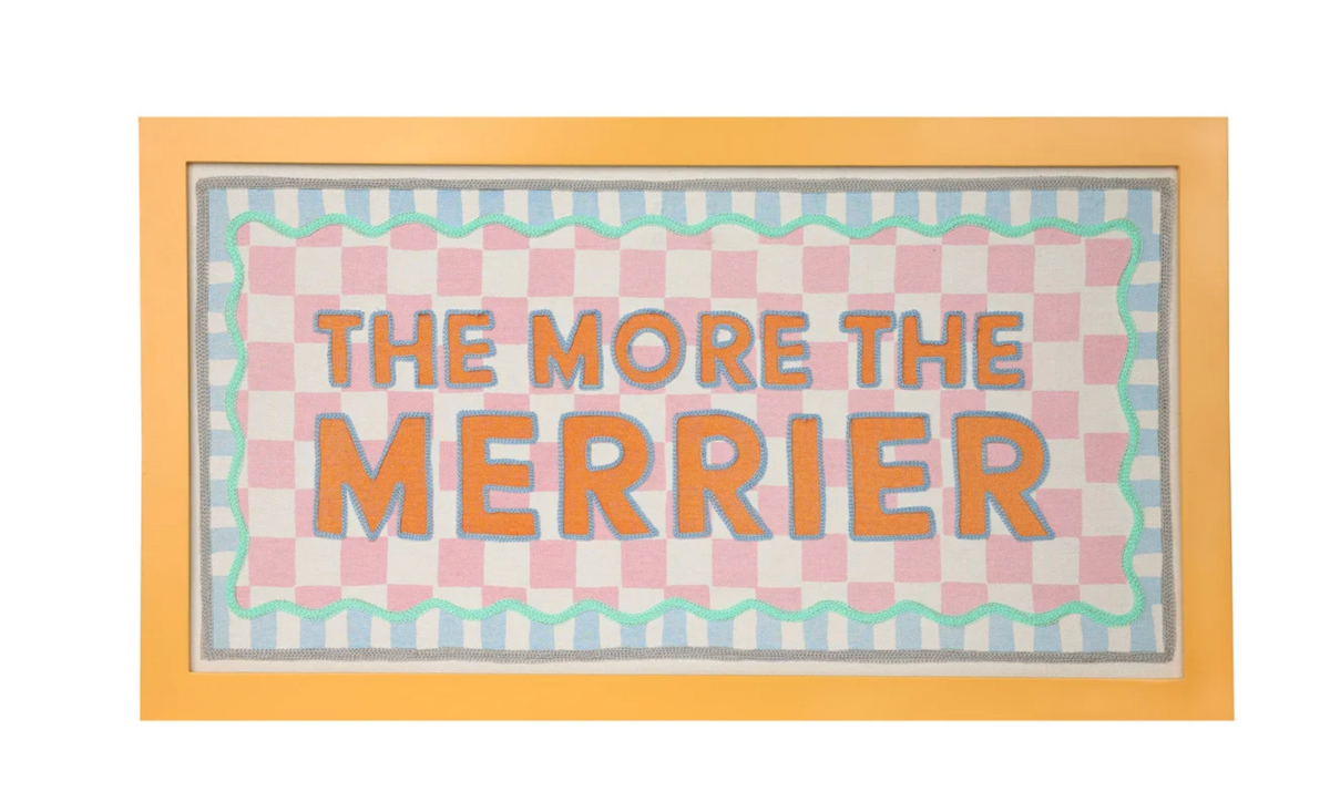 Talking Tables The More the Merrier framed fabric wall sign with pink checks, turquoise wavy border and blue stripes.