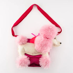 The Children's Poodle Bag features fluffy pink fur accents on the head, ears, tail, and feet, a glittery body, and a red adjustable strap—making it a playful accessory for any outfit.